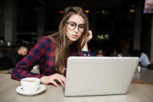 A young woman browsing her computer